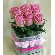 Swarovskis pink roses in a glass cube
